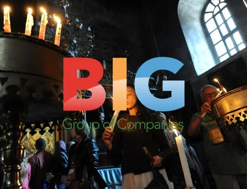 Christian pilgrim lights candle in Bethlehem church