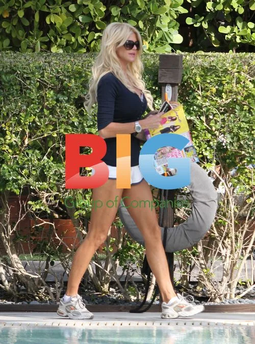 Victoria Silvsted relaxes poolside in Miami