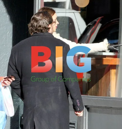Julian Schnabel and wife window shopping in Soho