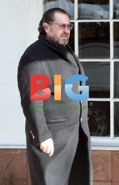 Julian Schnabel and wife window shopping in Soho