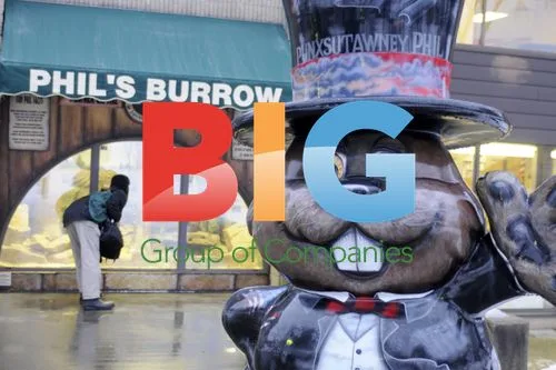 Visitors look into Phil's Burrow on Groundhog Day