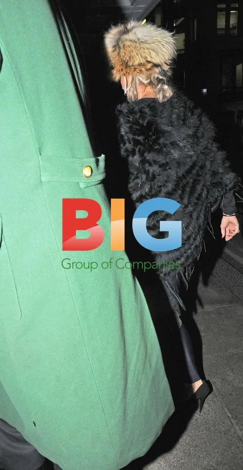 Katie Price Seen with Personal Aid in London