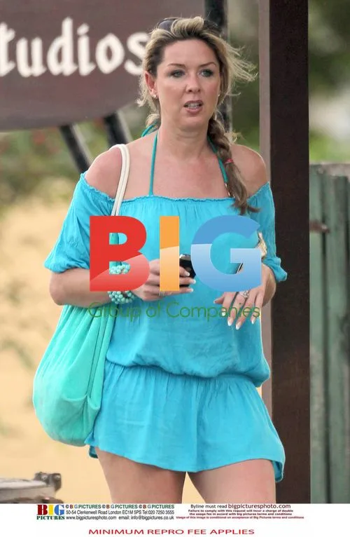 Claire Sweeney Relaxes in Turquoise Bikini