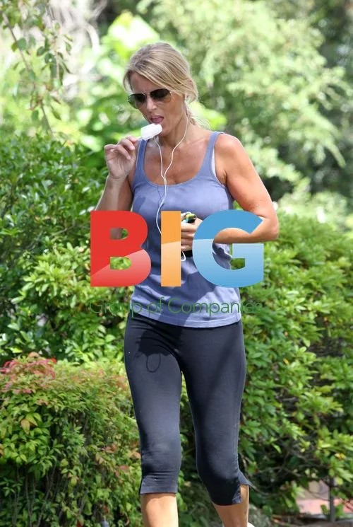 Simone Warne Jogs and Eats Ice Lolly