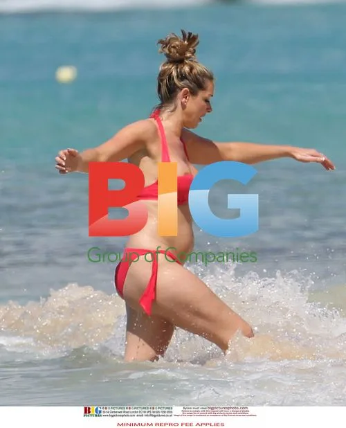 Celebrity Bikini Malfunction on Caribbean Beach