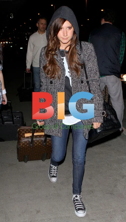 Ashley Tisdale Arrives at LAX