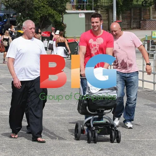 Kris Smith with baby Ethan at Bondi