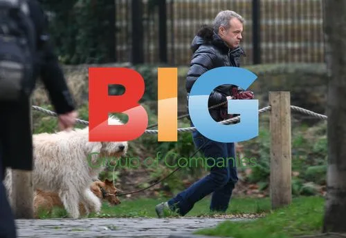Graham Norton walks dogs, carries poo