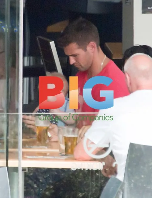 Kris Smith and baby Ethan at Bondi beach