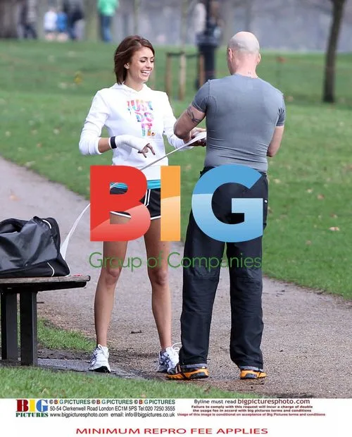 Liz Locke and personal trainer exercise in London park