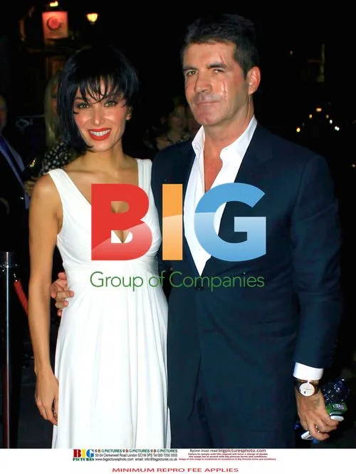 Simon Cowell and fiance at party