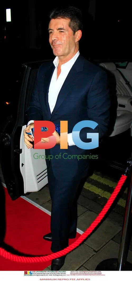 Simon Cowell and fiance at 50th birthday party