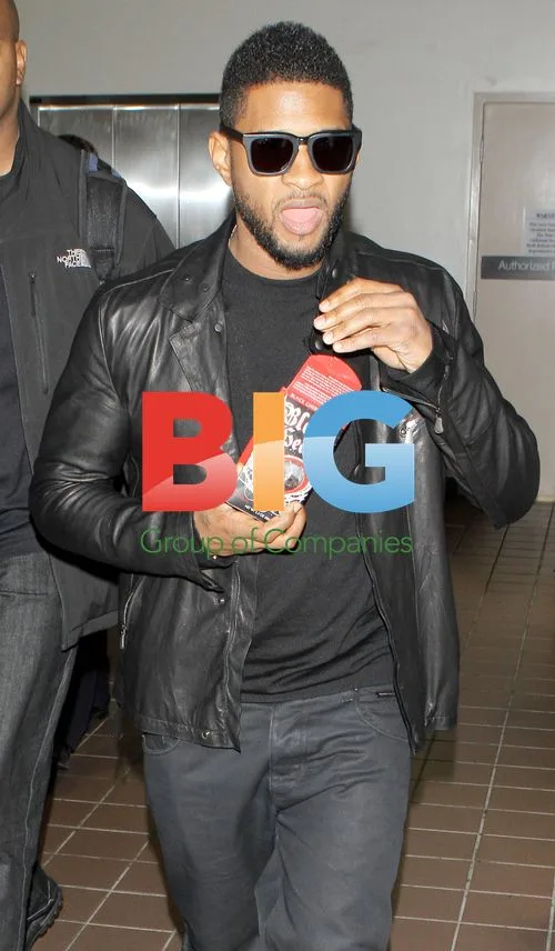 Usher Eating Licorice at LAX