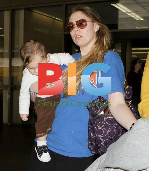 Kailyn Lowry with baby Issac and boyfriend Jordan Wenner at LAX