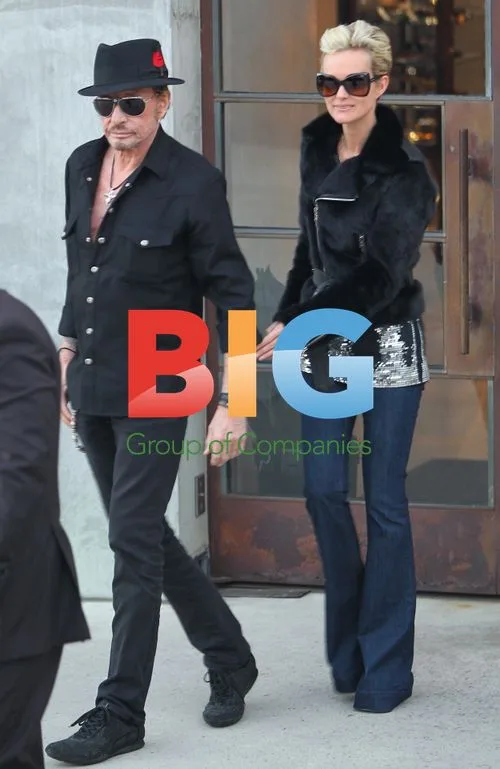 Johnny Hallyday and Laeticia Hallyday Leaving Max Fields