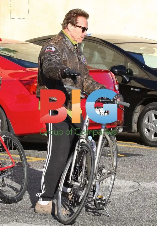 Arnold Schwarzenegger Rides Bike