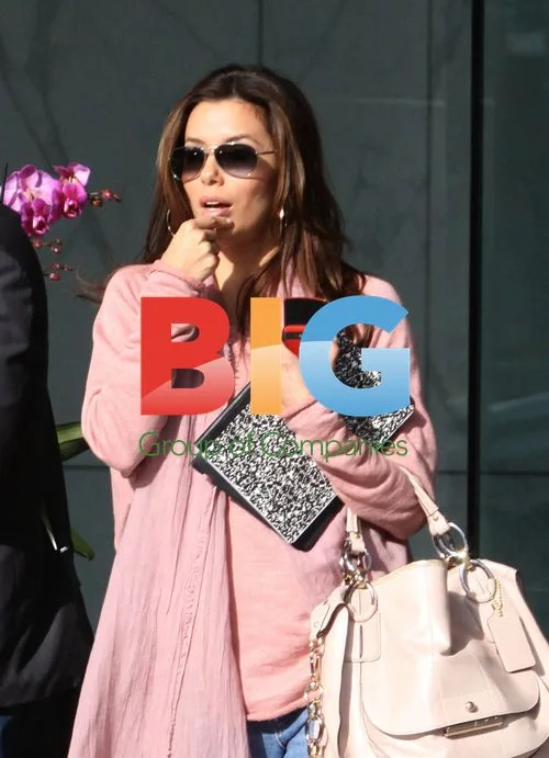 Eva Longoria texting after office visit