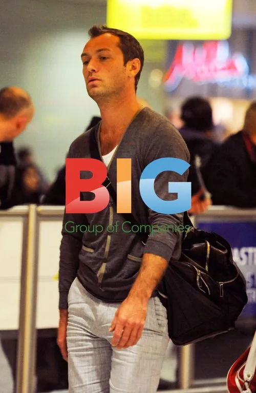 Jude Law Arrives at London Airport