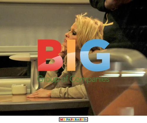 Pamela Anderson making funny faces on train