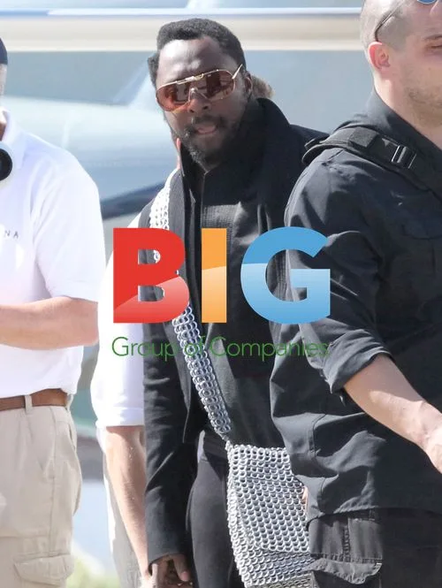 will.i.am catches helicopter in St Barth