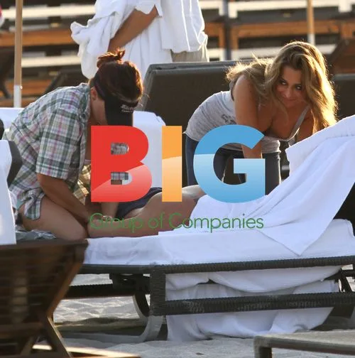 Mammucari gets massage from women on Miami Beach