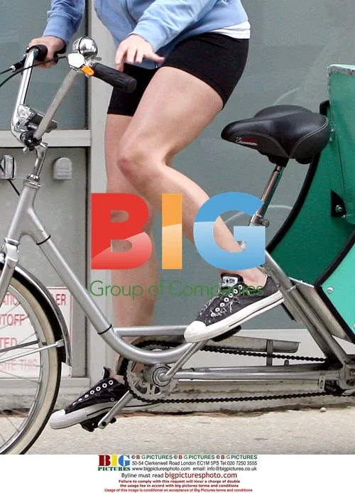 Kate Winslet arrives on tricycle with kids