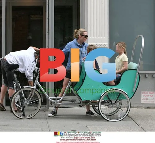 Kate Winslet Arrives on Tricycle with Kids