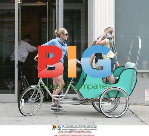 Kate Winslet Arrives on Tricycle With Kids