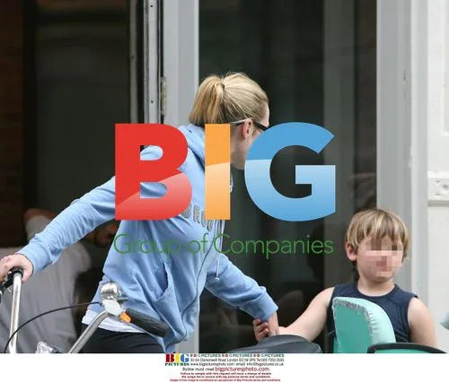 Kate Winslet arrives on tricycle with kids