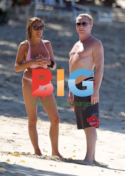 Michael Flatley shows off 'man-boobs' in Caribbean