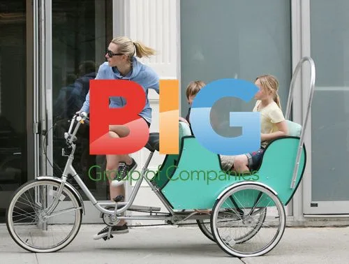 Kate Winslet rides tricycle with kids