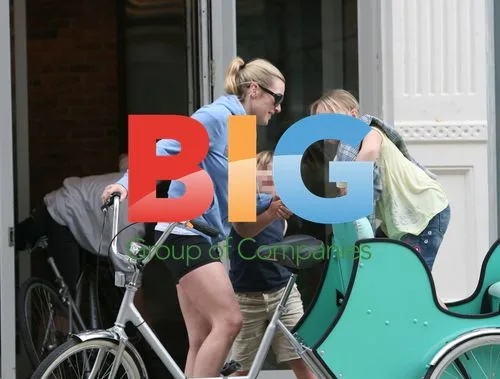 Kate Winslet spotted on tricycle with kids