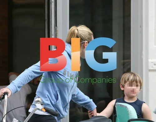 Kate Winslet with kids on tricycle