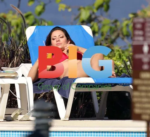 Clare Nasir in Red Bikini on Beach Vacation