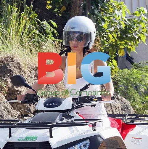 Simon Cowell and Mezhgan Hussainy on quad bikes
