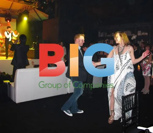 Milla Jovovich and Ryan Kavanaugh dancing at Bvlgari event