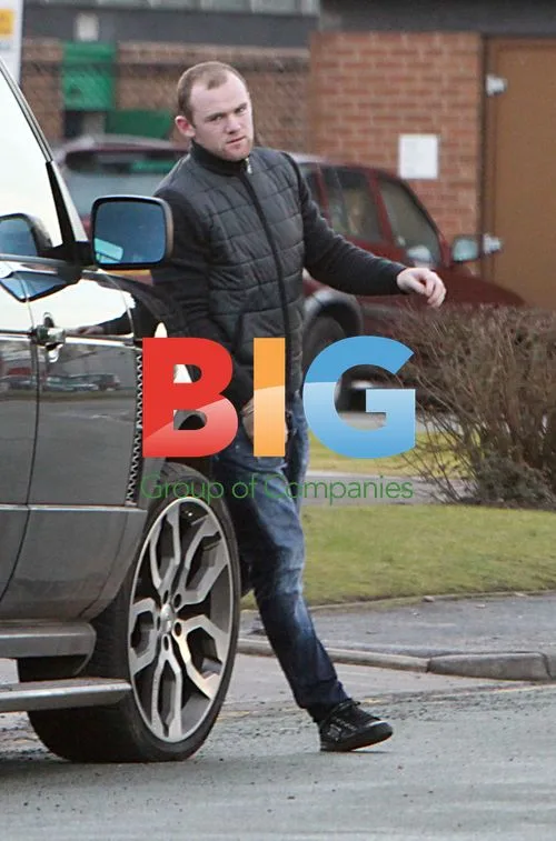 Wayne Rooney and Coleen Rooney with son Kai