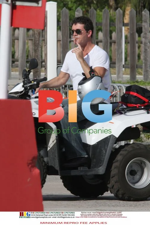 Simon Cowell and Mezhgan Hussainy on Quad Bikes