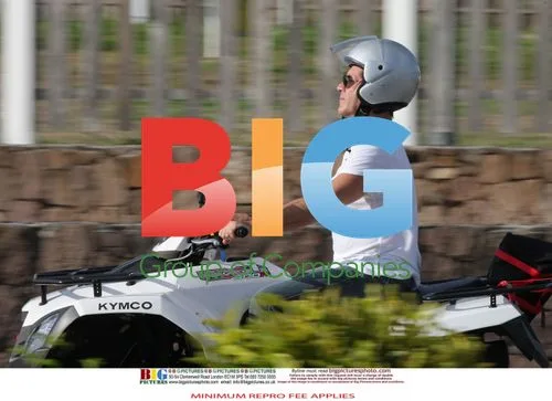 Simon Cowell and Mezhgan Hussainy on Quad Bikes