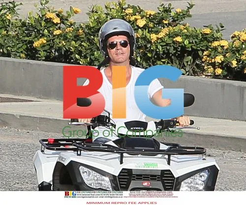 Simon Cowell and Mezhgan Hussainy Ride Quad Bikes