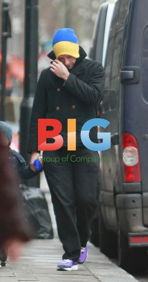 Chris Martin and kids take dog for walk in London