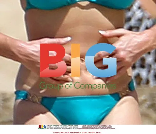 Claire Sweeney in Turquoise Bikini