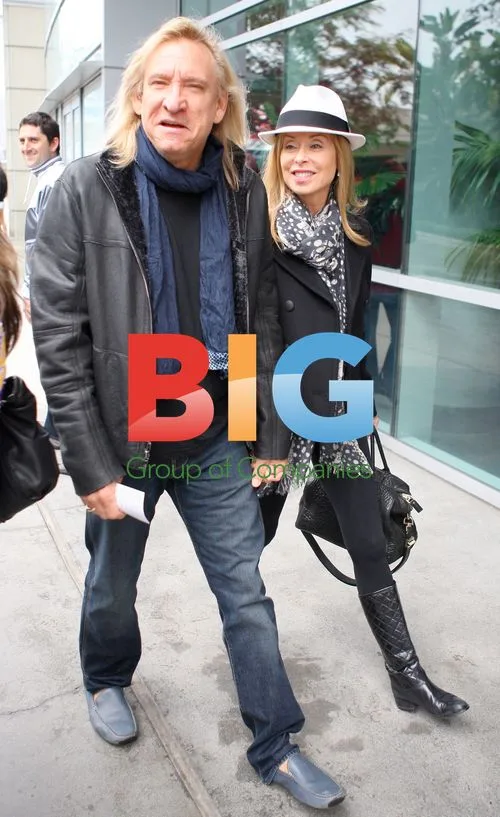 Joe Walsh Leaving Laker Game in Rain