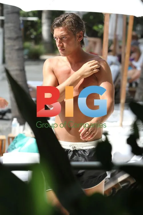 Mesut Ozil Sunbathes in Miami