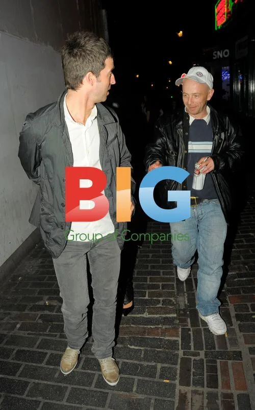 Noel Gallagher and wife out in Soho