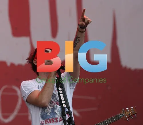 Alexander Gaskarth of All Time Low performing