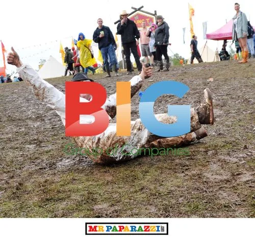 Fans Celebrate Despite Bad Weather at T In The Park