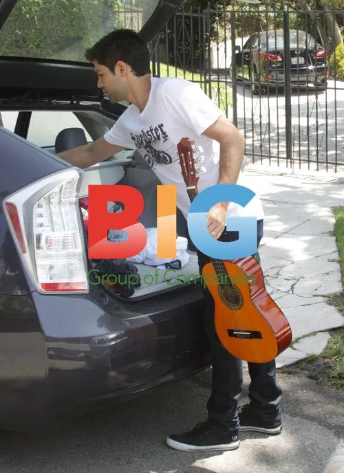 Adrian Grenier with dog and belongings