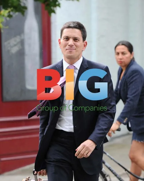 MP David Miliband Shopping at Wine Store