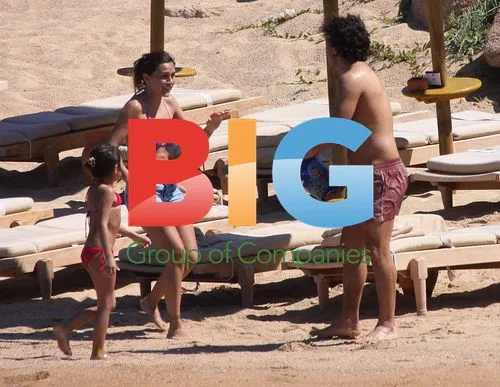 Carlos Tevez on beach with family